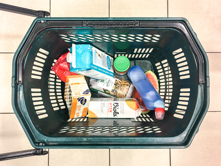 Filled blow moulded bottle placed in shopping basket