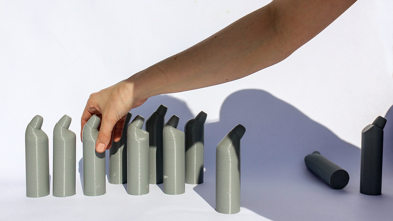 3D printed scale models to explore capsule position on bottle.